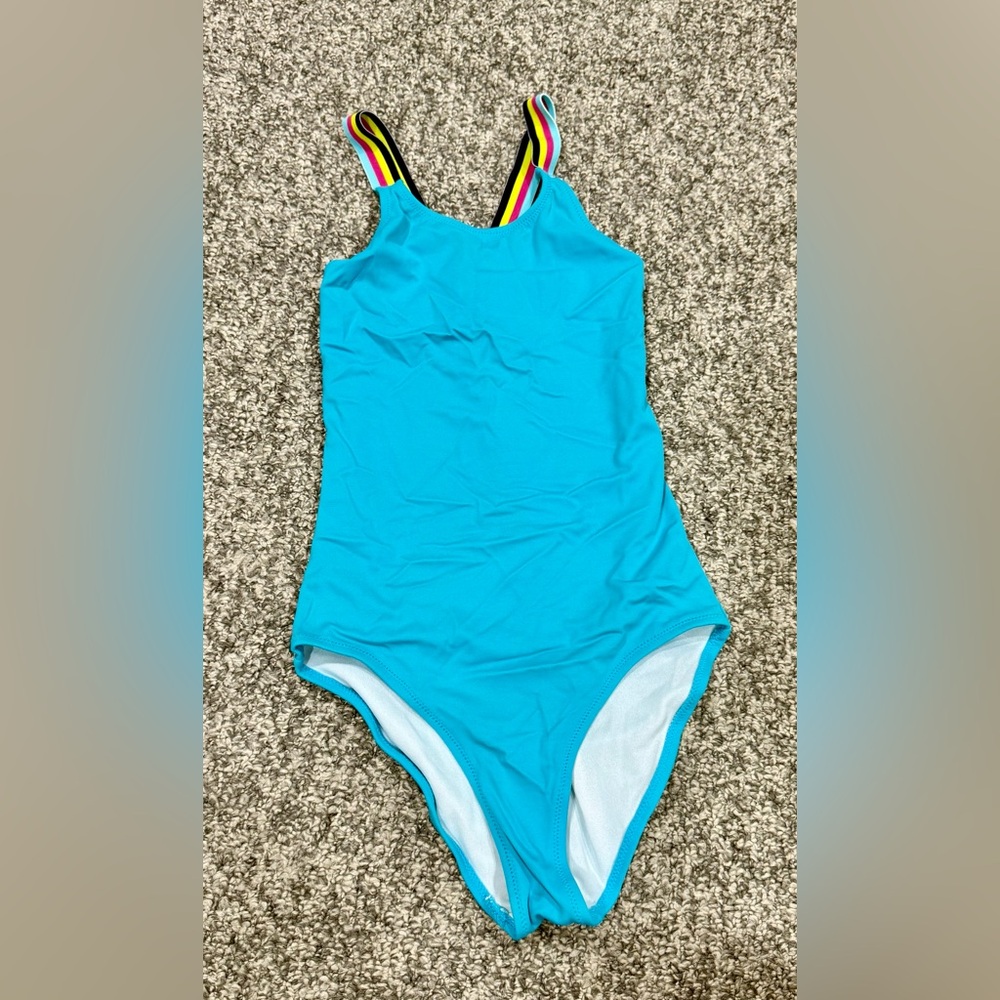 Kanu teal one piece swimsuit. Never worn. Size 10. Crisscross back (multicolor)